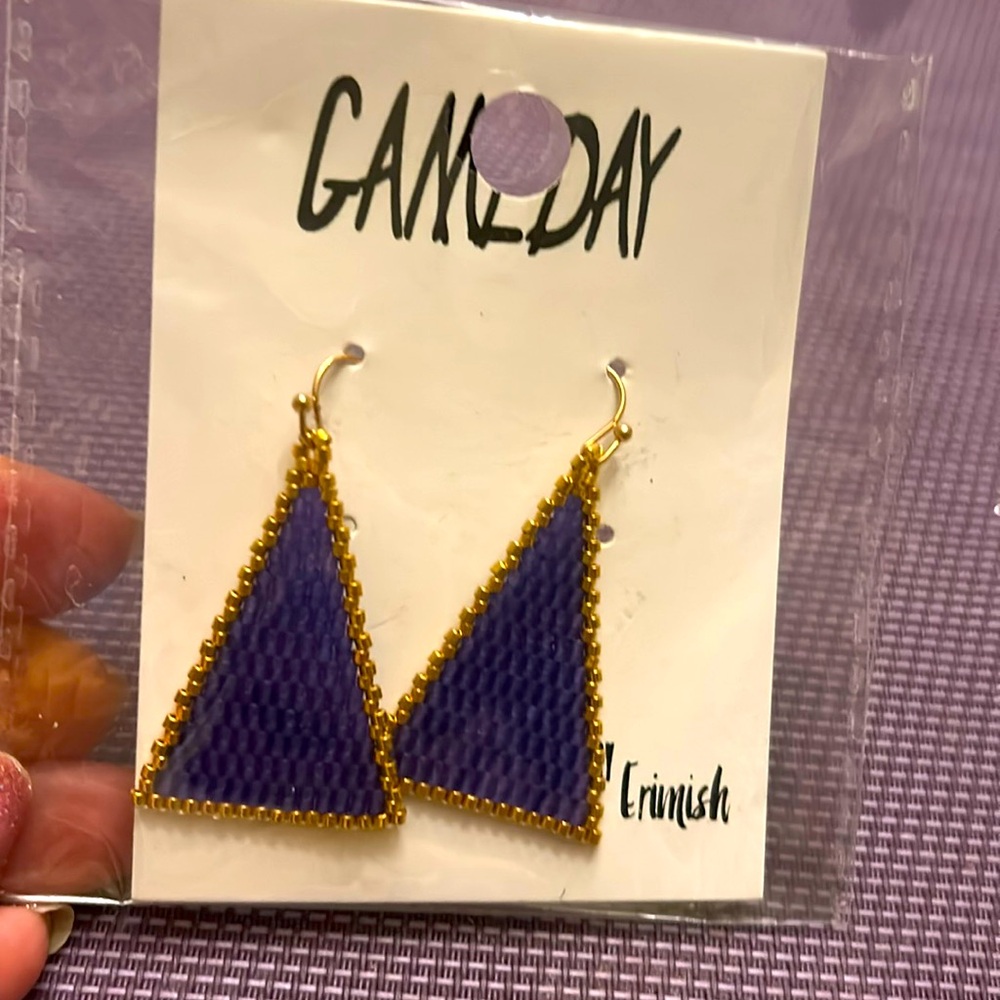 Erimish game day purple earrings. New be in bag.